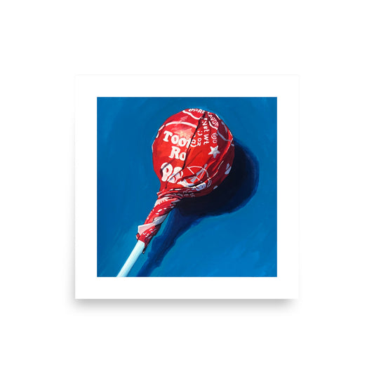 Red Tootsie Pop on Blue